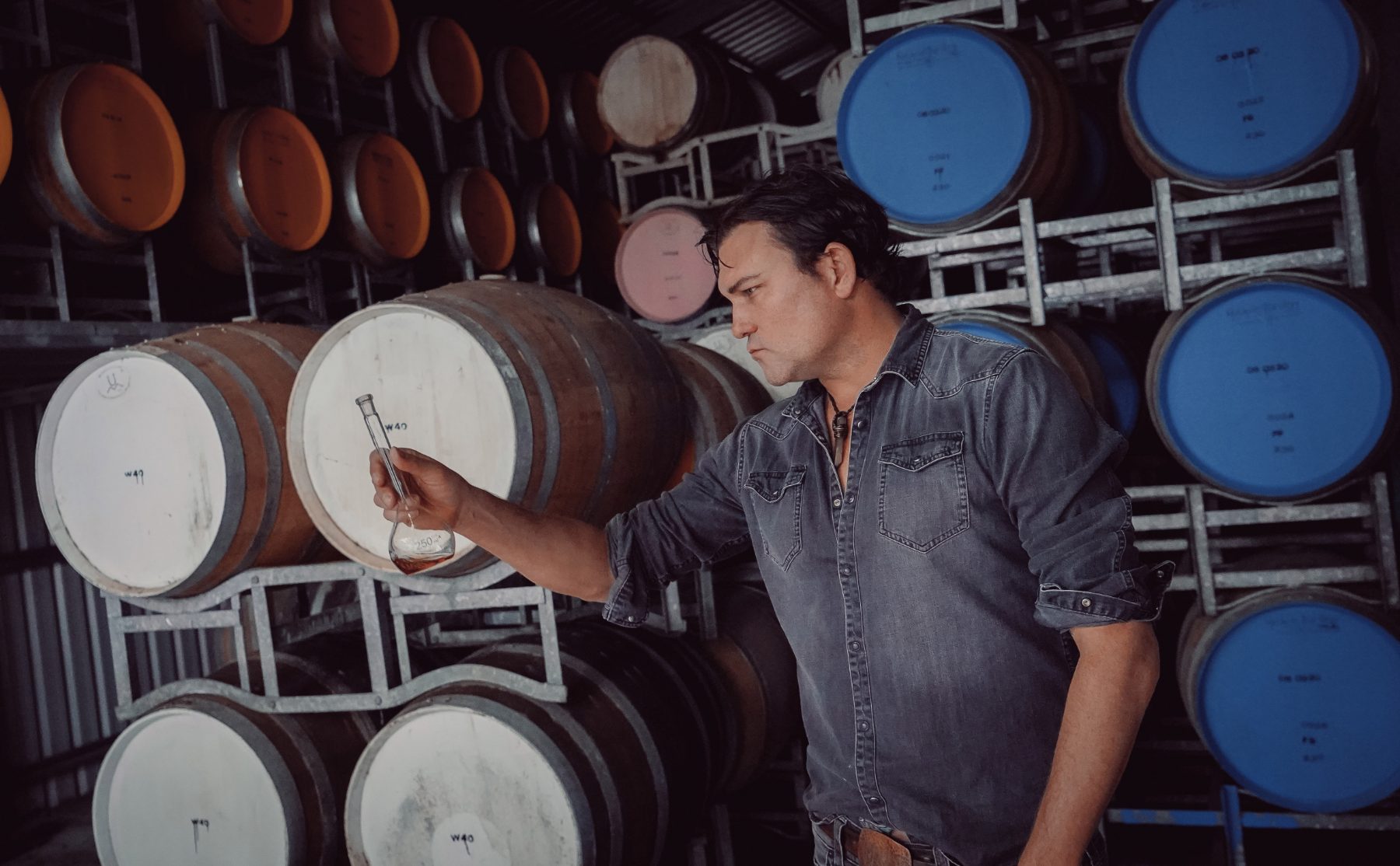 Chalking the head of a maturing cask in the barrel room at Walkamin