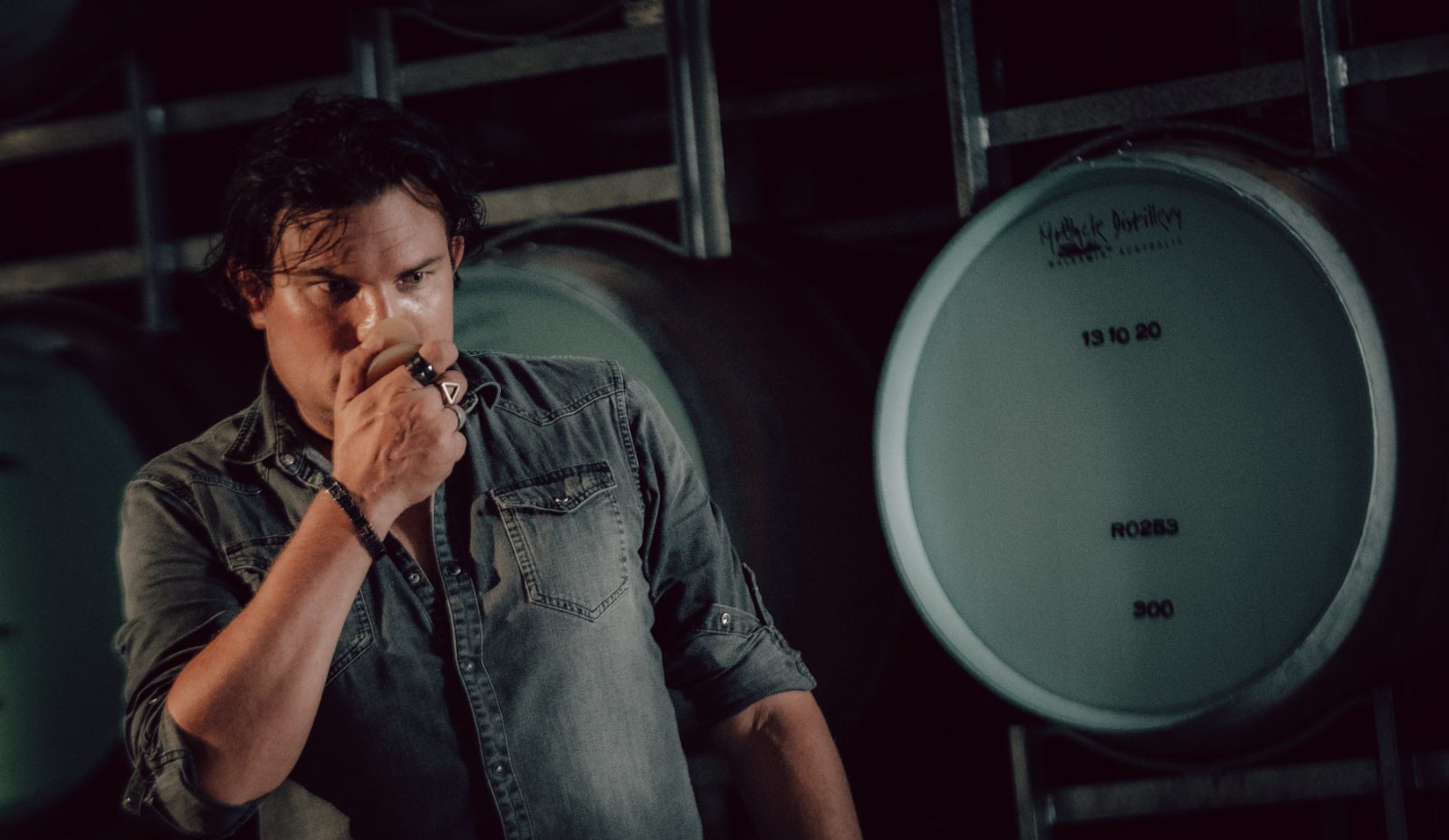 Head distiller nosing a sample drawn straight from a maturing cask